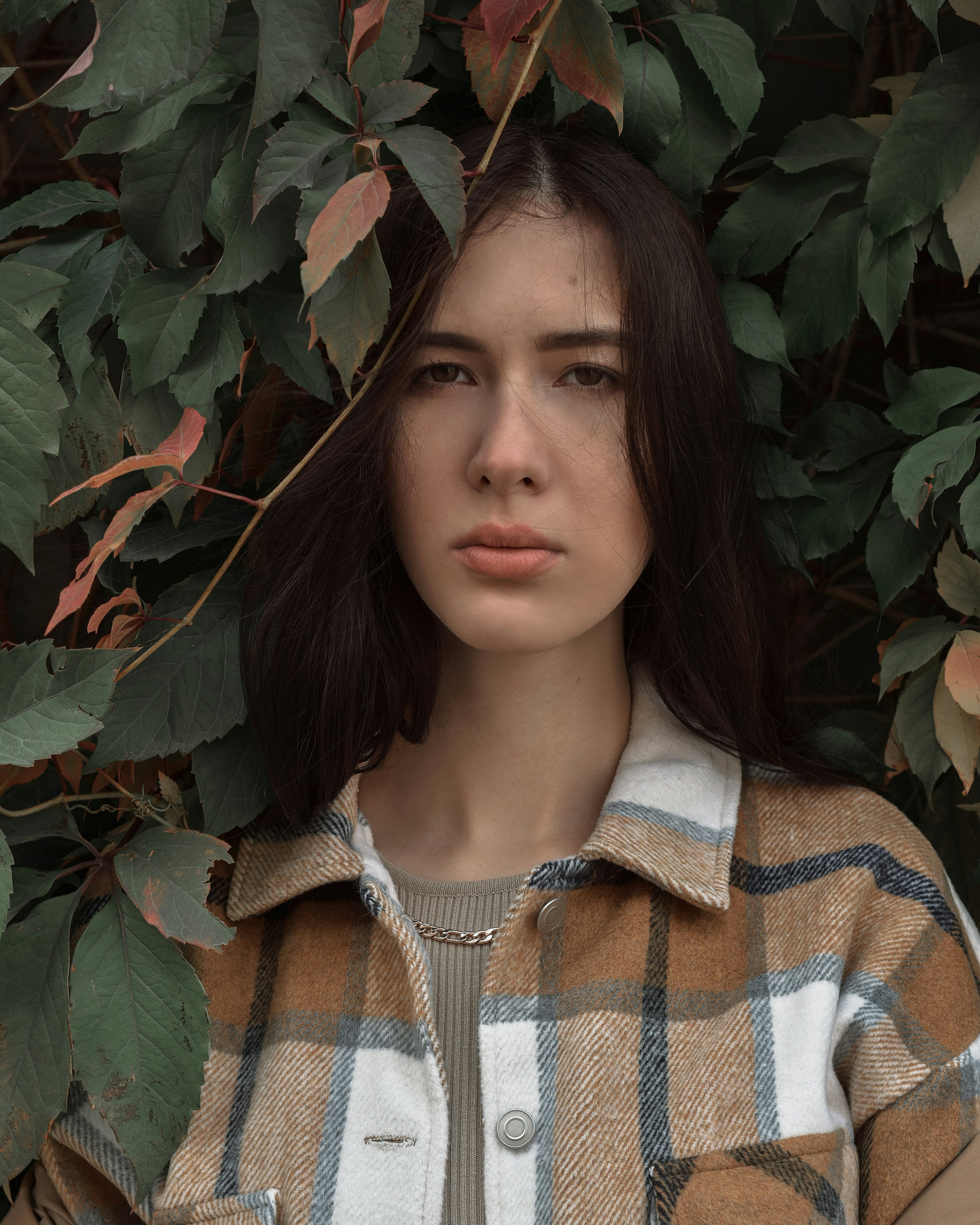 woman in brown and white striped button up shirt